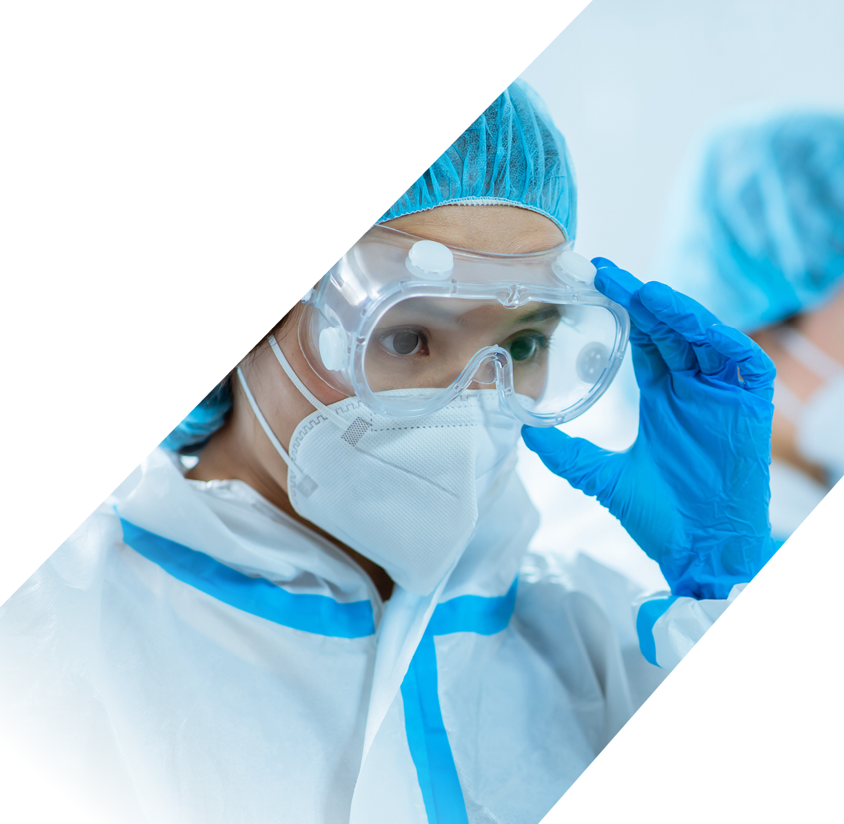 female medical worker wear protective suits and ready to take care of coronavirus patient in isolation room