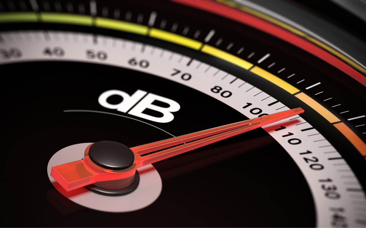 Decibel measurement. Gauge with green needle pointing 105 dB, concept of noise level